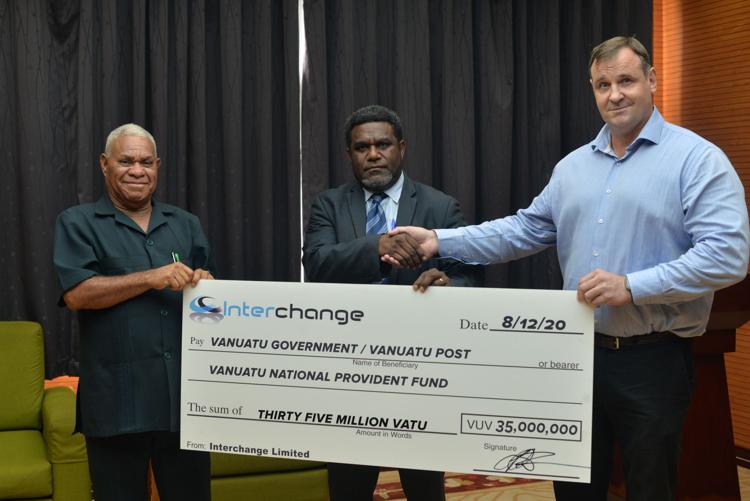 Interchange Managing Director presenting dividends to public shareholder