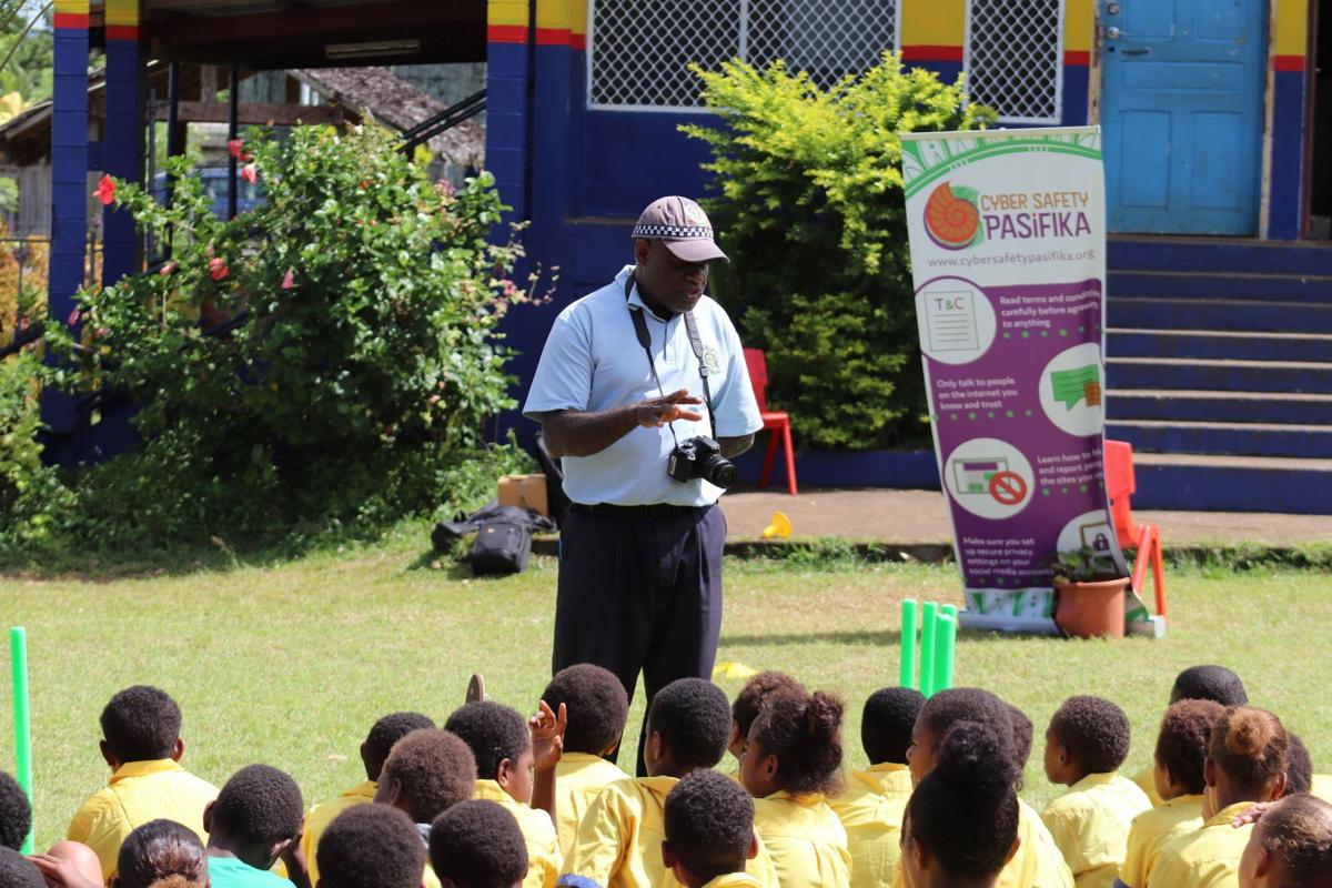 Vanuatu Police Cybercrime unit officer giving awareness